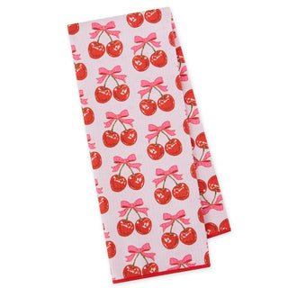 Two kitchen towels with cherry and bow pattern on a white background