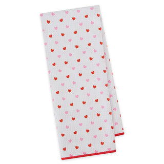 White towel with red and pink heart pattern on a white background