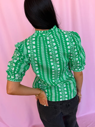 woman wearing green top 