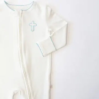White baby onesie with a cross design on a white background