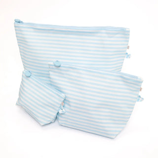 Three light blue and white striped zippered pouches of different sizes arranged on a plain white background.