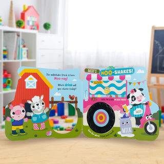 Two children's books with farm-themed illustrations on a wooden surface.