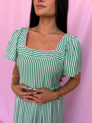 woman wearing green dress