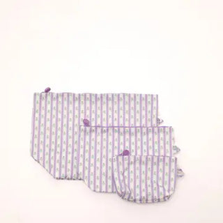 A set of three reusable cloth baby wipes in a lavender and white striped pattern with purple trim, arranged on a plain white background.