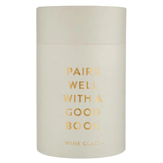 Beige container with gold text 'PAIRS WELL WITH A GOOD BOOK' on a white background