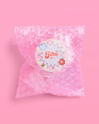 Pink bubble wrap with a decorative label on a pink background