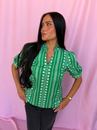 woman wearing green top 