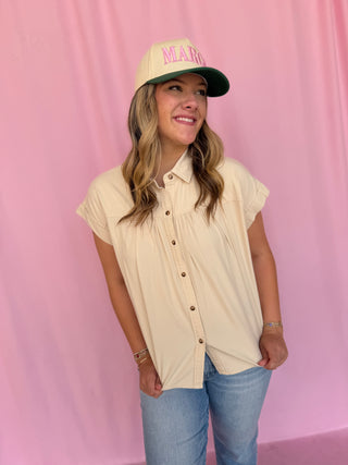 girl wearing a beige top