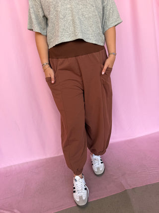 girl wearing brown pants