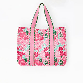 Floral tote bag with pink straps on a white background