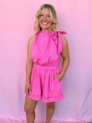Woman wearing pink romper