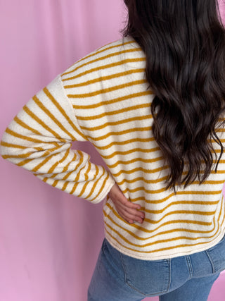 girl wearing a striped cardigan