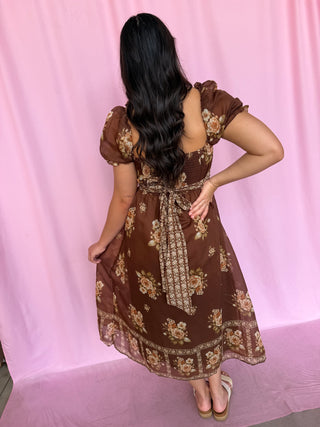 Girl wearing a brown dress