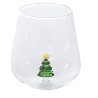 Two clear glass tumblers with Christmas tree designs on a white background