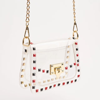 White handbag with colorful studs and gold accents on a white background