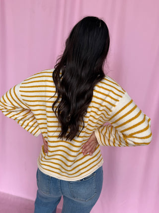 girl wearing a striped cardigan