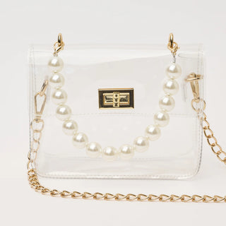 Clear handbag with pearl chain strap on a white background
