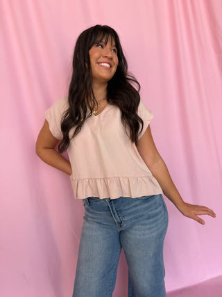 girl wearing a pink top
