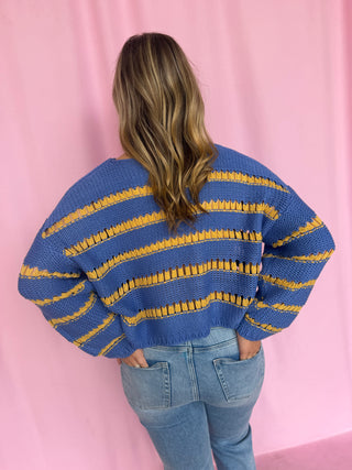 girl wearing a striped sweater 
