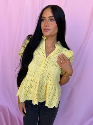 woman wearing a yellow top