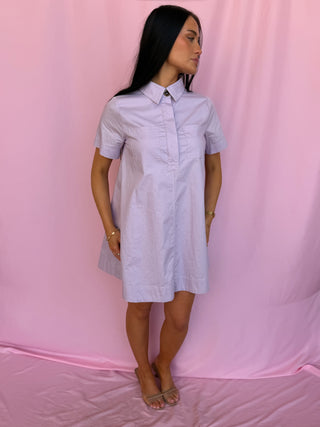 woman wearing a purple dress