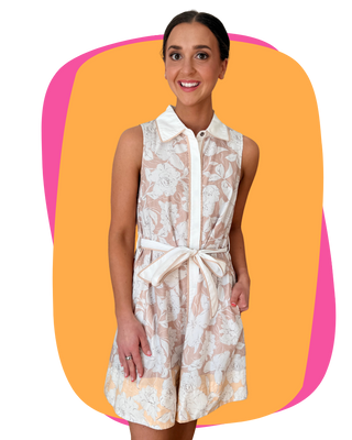 Woman wearing a floral dress with a white collar against a colorful background