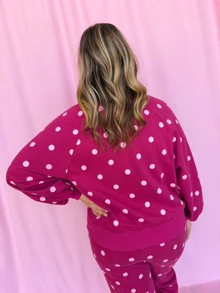 girl wearing a polka dot set 