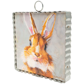 Decorative wall hanging with a rabbit design on a white background