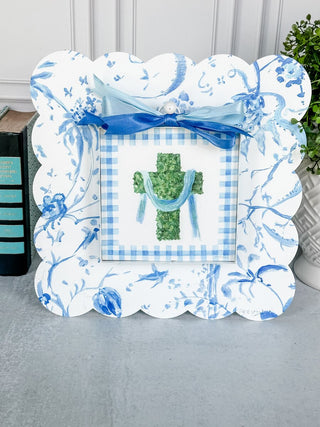 Decorative framed picture with blue and white checkered design on a neutral background