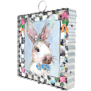 Decorative wall art with a rabbit illustration on a corrugated metal background