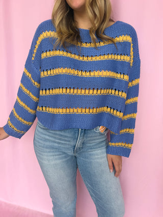 girl wearing a striped sweater 