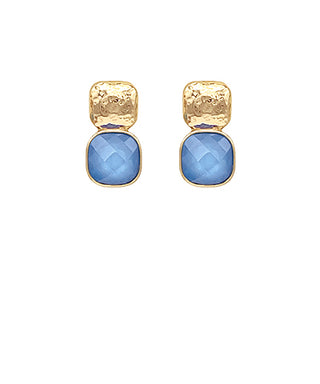 Gold earrings with blue stones on a white background