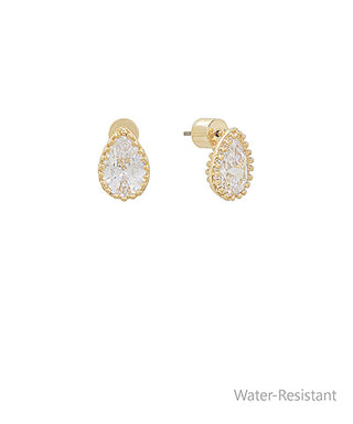 Gold earrings with clear gemstones on a white background