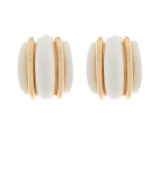 Pair of earrings with white central stones and gold bands on a white background