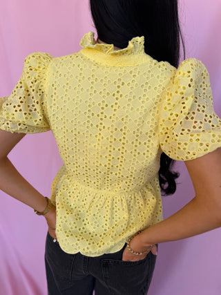 woman wearing a yellow top