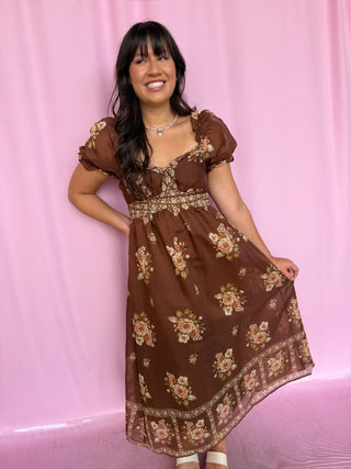 Girl wearing a brown dress