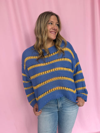 girl wearing a striped sweater 
