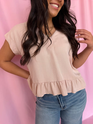 girl wearing a pink top