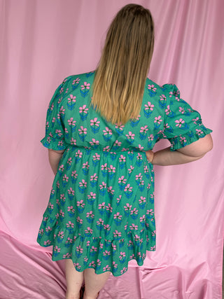 woman wearing a short floral dress 
