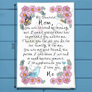 Card with a heartfelt message to 'My Dearest Mom' surrounded by flowers and butterflies on a blue wooden background.