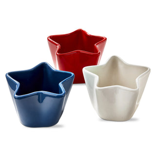 Three star-shaped bowls in red, blue, and white on a white background