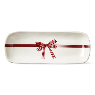 Rectangular ceramic tray with a red bow design on a white background