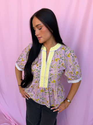 woman wearing a floral top 