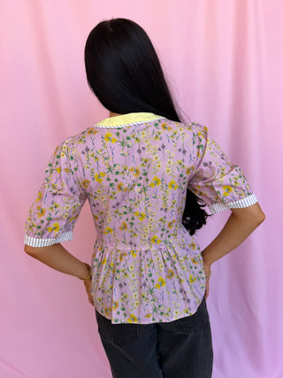 woman wearing a floral top 