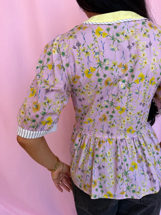 woman wearing a floral top 