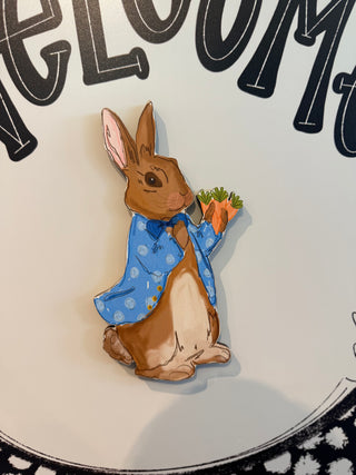 Illustration of a rabbit character holding carrots with text in the background