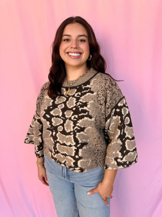woman wearing a printed sweater 