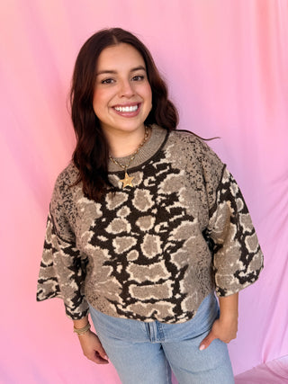 woman wearing a printed sweater 