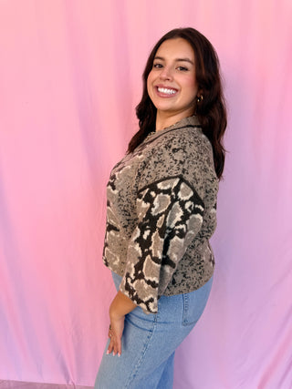 woman wearing a printed sweater 