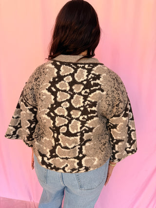 woman wearing a printed sweater 